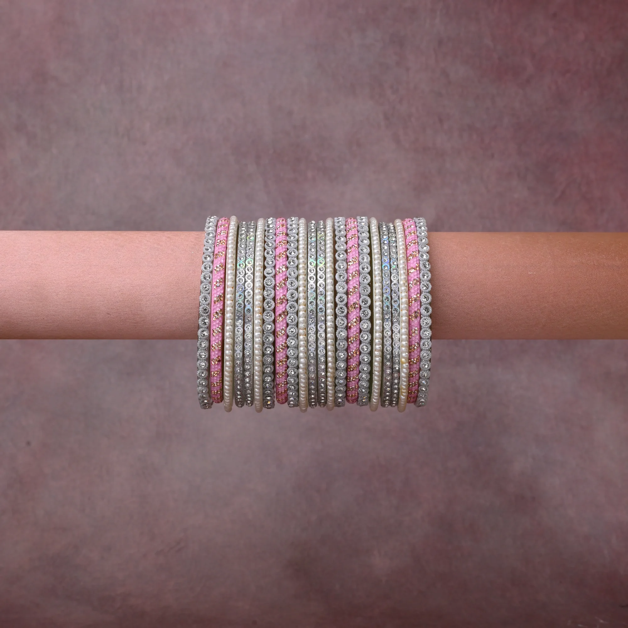 A grounding Silver forms the heart of the set, while touches of Pink add charm.

A thoughtful composition of Pearls, Crystals, Metal, Enamel, designed to feel complete without being heavy.
Each element layers seamlessly, creating a look that is refined, wearable and quietly striking.